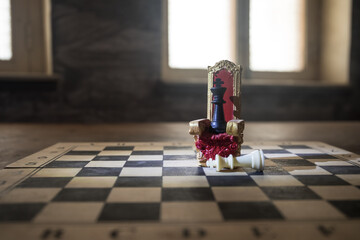 Wall Mural - Red royal chair miniature on wooden table. Medieval Throne on chessboard. Chess board game concept of business ideas and competition and strategy ideas concept. Selective focus