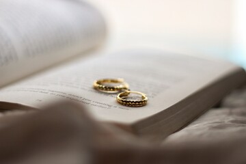 earrings on a book