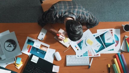 Poster - Aerial view of smart businessman calling manager while choose color. Professional interior designer looking at laptop screen while select and design main theme color for product at meeting. Symposium.