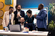 © DC Studio - Finances team look at stock market trends and celebrating their victory in acquiring more capital for development. Satisfied cheerful workers and manager feeling proud about their team progress.