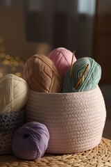 Canvas Print - Knitting material. Skeins of soft yarn and crochet hooks on table indoors