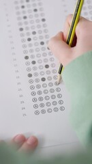 Poster - Hands, writing and student with multiple choice test in classroom at school for scholarship admission. Education, learning and closeup of person study with practice exam, assessment or question paper