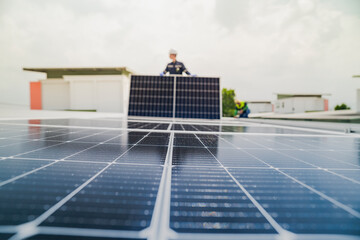 A worker installs or maintains solar panels on a rooftop. The image highlights renewable energy technology, solar power systems, and the role of workers in implementing sustainable energy solutions.