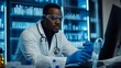 © A4719 - Black Scientist Working in Laboratory with Computer and Test Tube
