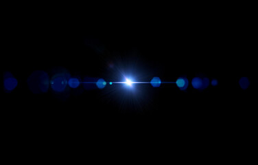 A bright blue light shines in the center of the image, creating a large burst of light rays that spread out across the black background.