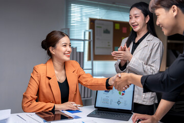 Wall Mural - Business people shaking hands during a corporate meeting