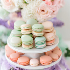 sweet macaroon displayed on two level standing platform