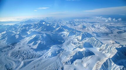 Poster - The sky is blue and the mountains are covered in snow. The snow is white and the mountains are tall