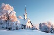 © Zain - A picturesque church covered in snow with its steeple reaching towards a clear blue sky The surrounding trees are dusted with snow and the warm light from the church windows contrasts with the cold.