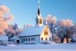 © Zain - A picturesque church covered in snow with its steeple reaching towards a clear blue sky The surrounding trees are dusted with snow and the warm light from the church windows contrasts with the cold.