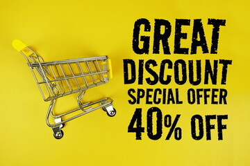 Wall Mural - Great Discount 40% Special Offer text with trolley shopping cart on yellow background