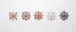 © wasan - Intricate Christmas snowflake ornaments in metallic finishes, Christmas decorations, winter wonderland concept