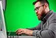 © bazargul - Close up of a man with a beard using a touchpad on a laptop with