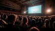 © OHMAl2T - Engaged audience watching a film in a packed theater