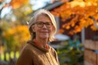 © Evon J - Senior Woman Enjoying Autumn Colors Outdoors
