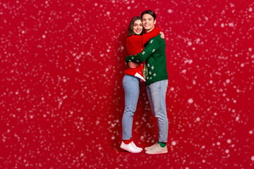 Poster - Full length profile photo of two lovely peaceful people cuddle empty space isolated on red color background