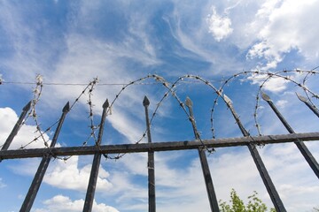 the barbed wire fence of protected prison territory