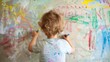 © red_orange_stock - A young child enthusiastically draws with crayons on a wall, expressing creativity in a bright and cheerful room full of colors