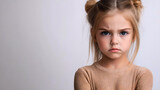 Young Girl with Arms Crossed and Angry Expression
