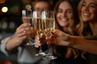 © Fridocha - Friends toasting with champagne glasses in a celebratory setting.