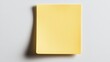 © Preeyanuch - A vibrant yellow note pad positioned on a gray surface, ideal for creative projects and organizational tasks.