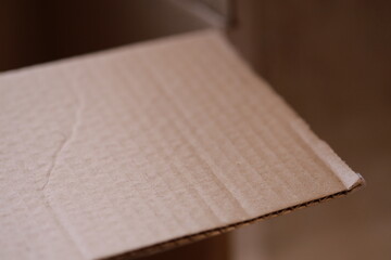 Aufkleber - Close-up of a cardboard box on a table, suitable for e-commerce or packaging designs.