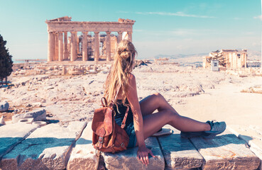 Wall Mural - Young female tourist looking at Parthenon Athens greece temple