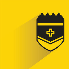 Wall Mural - shield badge with shadow on yellow background