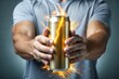 © Introvertia - Man holding energy drink can with sparkling lights emanating from it