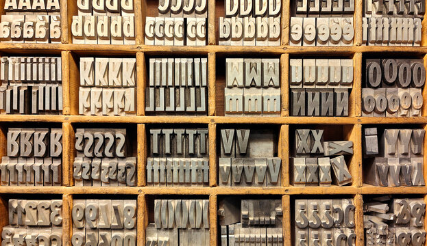 Vintage letterpress printing pieces in their wooden drawer