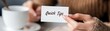 © TENTIP - A hand holding a card with 'Quick Tips' written on it, suggesting useful advice or guidance over coffee, perfect for business or learning contexts.
