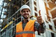 © Vii - A happy construction worker giving a thumbs up sign on site