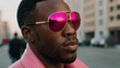 © Serhii - A black man in pink sunglasses