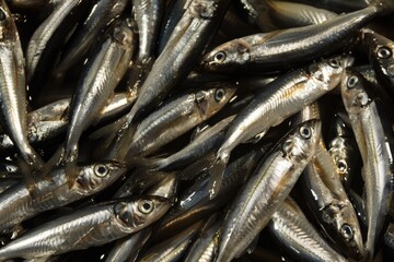 A pile of small fish sitting on a table, great for food or decorative use