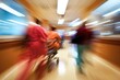 © Vii - A blurred image of a hospital corridor with a person pushing a gurney, suitable for medical or healthcare related projects