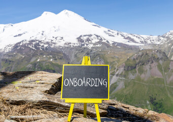 Onboarding success symbol. Concept word Onboarding on beautiful chalk blackboard. Mountain Elbrus. Beautiful mountain Elbrus background. Business onboarding success concept. Copy space.