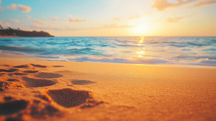 A close-up view of beach sand, revealing its fine texture as it shimmers under the warm glow of the golden-orange sunset light