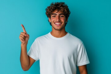 Young arab man in t-shirt standing over isolated blue background smiling cheerfully and pointing with palm while looking at camera, Generative AI