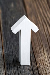 Poster - A white wooden arrow pointing upwards, symbolizing progress and direction, set against a rustic wooden background for a clean, modern look.