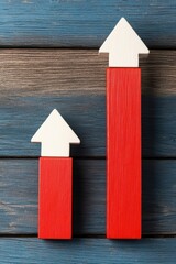 Poster - Two red wooden arrows on a rustic blue wooden background, symbolizing growth, progress, and upward movement in business or personal development.