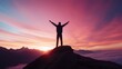 © fotofabrika - A person celebrates the sunset from a mountain peak surrounded by breathtaking scenery and vibrant colors in the sky
