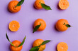 © sosiukin - Many fresh ripe mandarin as colored background, top view. Elegant background of clementines and mandarin slices Top view flat lay