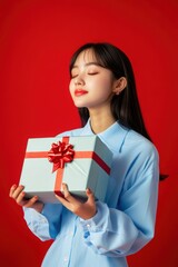 Happy female with gift box in holiday season.