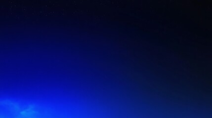 Wall Mural - a deep blue sky with a few stars scattered across the surface.