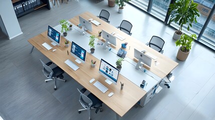 Poster - Empty modern workspace with computers lined up on a large table seen from above  Overhead view of a clean minimalist office setup with electronic devices neatly organized on a professional