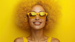 © smth.design - Radiant woman with curly yellow hair wearing sunglasses smiling brightly