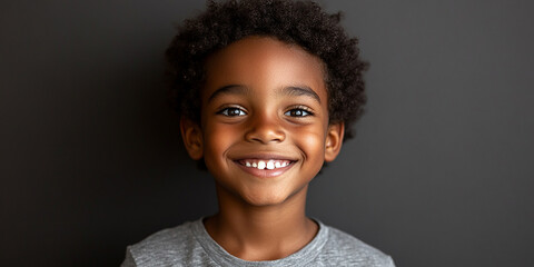 Black teenager boy on a studio background