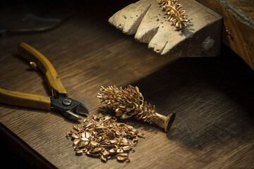 Different goldsmiths tools on the jewelry workplace. Jeweler at work in jewelry. Desktop for craft jewelry making with professional tools. Close up view of tools.