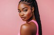 © Surachetsh - Black women with elegant braids and glowing skin on vibrant backdrops, ideal for luxury skincare or cosmetic promotions. Pink Background.