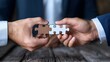 © maesarin - Hands Holding Puzzle Pieces to Complete Business Strategy and Success Plan  Concept of Problem Solving for Achieving Growth Innovation and Productivity
